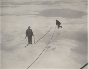 Image of Running a line (Mate Davis) to mooring in the ice (Captain Comer) 