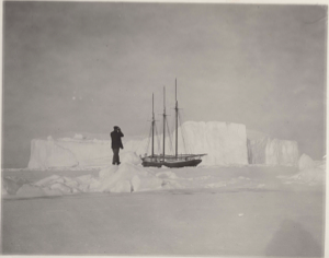 Image of The GEORGE B. CLUETT trapped near iceberg. Man with binoculars studying it (wrong temp ID?)