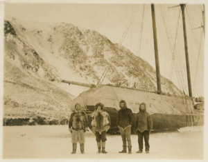 Image of C.L.E. group on ice at stern of "Cluett" Ekblaw, Hovey, Allen, Tanquary