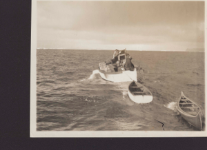 Image of Inger Lis with tender and canoe in tow leaving the "Cluett"