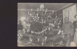 Image of A Christmas tree. Mrs. Rosen, Rev. Mirch, Gove. Vinteberg and family