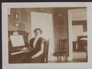 Image of Mrs. Rosen at the seminary piano