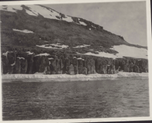 Image of Breeding place of dovekies and black guillemots at Cape Kendrick [Bird cliffs, with ice foot]