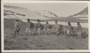 Image of Eskimos [Inuit] on the march to Sunrise Point