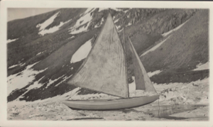 Image of Dory on the ice with sails set