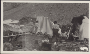 Image of Inuit families at Borup Lodge. Striped tupiks, kayak frame, supplies (wrong temp ID)
