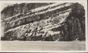 Image of Snow on striated cliff
