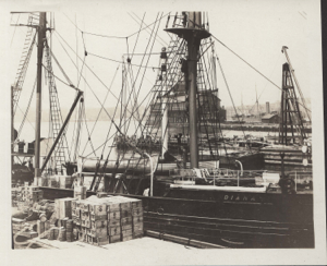 Image of The DIANA docked. Supplies ready for loading