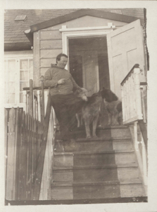 Image: White man with dogs, on church steps