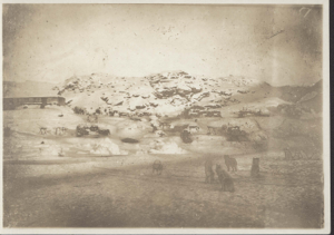 Image of Village in winter. Team in foreground