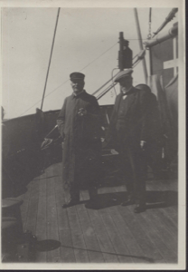 Image of Two men on deck. (Captain and guest?)