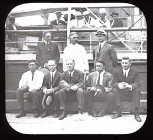 Image of Eight Expedition members, portrait by vessel