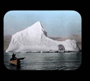 Image: Kayak on dory, 2nd kayak and iceberg beyond. Men in iceberg hole