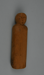 Image: Wooden doll with carved facial features