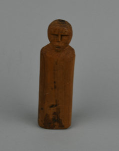 Image of Wooden doll with carved facial features