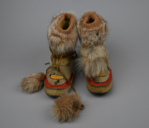 Image of Pair Alaskan fur boots, child-sized, with red trim and yellow beads