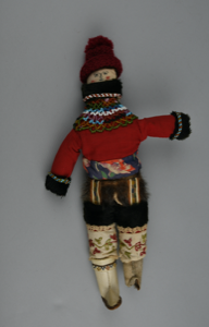 Image of Greelandic doll in traditional costume, beaded collar and cuffs