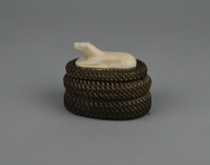 Image of Oval baleen basket with reclining bear finial