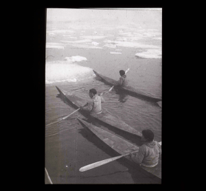 Image: Three kayakers among floes  [b&w]