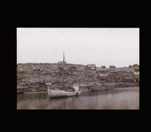 Image of West Greenland village. Fishing boats moored  [b&w]