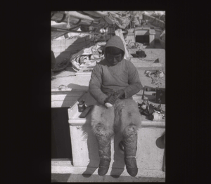 Image of Inuit boy with Little Auk, aboard  [b&w]