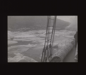 Image: Ice pans through rigging and over rail [b&w]