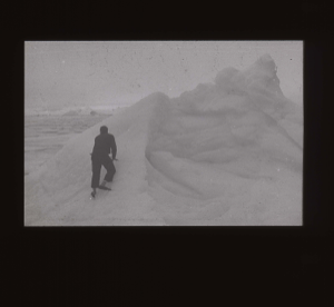 Image: Crewman climbs snowy peak  [b&w]