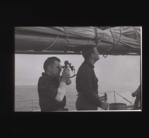 Image of Two crewmen. One uses sextant  [b&w]