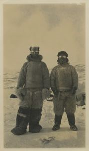 Image of Donald MacMillan and Etookashoo at Bay Fjord, wearing snow goggles