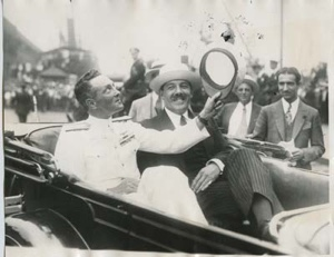 Image of Richard E. Byrd waving while riding up Broadway with Grover A. Whalen