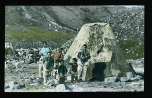 Image of Three Inuit women and three children in front of tupik [Inn-you-gee-to's family by tupik]