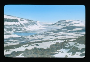Image of Landscape: Snow, hills, patch of open water