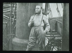 Image: Man standing on deck of a large vessel