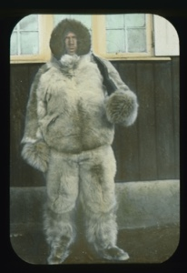 Image: Elmer Ekblaw in furs standing by Borup Lodge