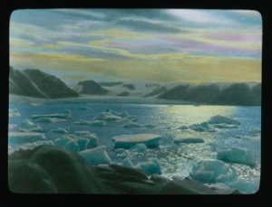 Image: Sunrise/set over mountains. Glacier in distance, ice floes in foreground
