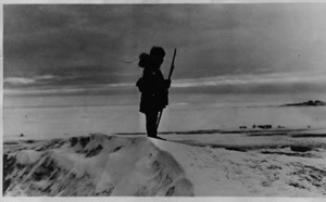 Image of Lone Eskimo [Inuk] waits for game to cross his path