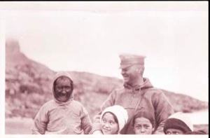 Image: Crew man with Inuit man and three children