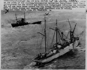 Image of The BEAR with her foremast broken. The tug IRVING BIRCH is beyond. Two men await rescue.
