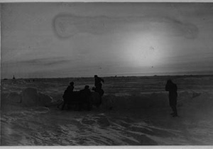 Image: Five men load a sledge. A sixth is near. Soviet Polar Expedition