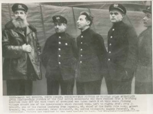Image of Four Russian scientists, rescued from an ice floe off the east coast of Greenland, with one of their rescurers