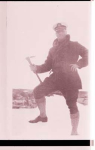 Image of man poses with pickax