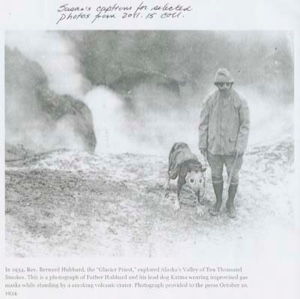 Image of Father Bernard Hubbard with his lead dog Katma, both wearing improvised gas masks ...