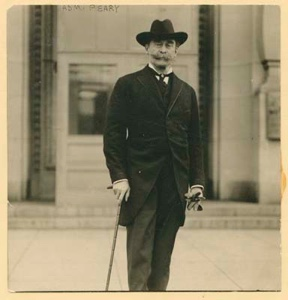 Image of Robert E. Peary, in formal attire, outside an urban building ...