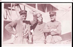 Image of Three men stand beside plane. One waves