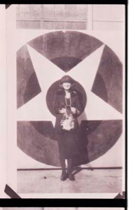 Image: Woman standing by star emblem