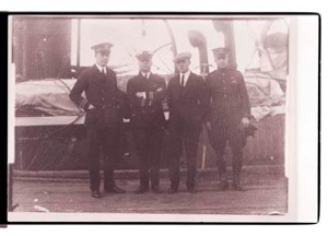 Image of Eugene McDonald, Donald MacMillan, unidentified man and Richard Byrd on the deck of the S.S. Peary