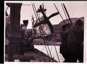 Image: Men on the S.S. PEARY, near a plane's propeller