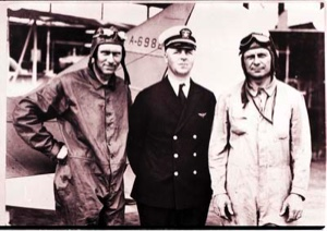 Image of Donald MacMillan and two aviators stand by A-6982