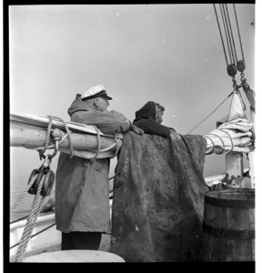 Image: MacMillan and Pilot leaning on main boom