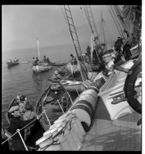 Image of "Shipwreck photos" - many small boats and men near tilted BOWDOIIN. 